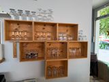 many empty glasses on the shelves in the room
