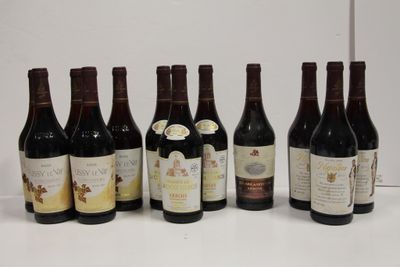 several bottles of wine are lined up on a table