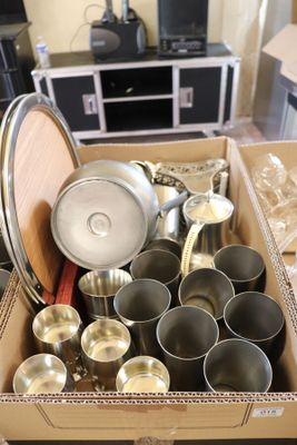 a box full of pots and pans sitting on a table