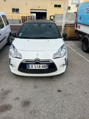 the car is parked in the parking lot next to the truck