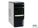 the desktop computer is sitting on a white surface with a black keyboard