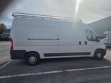 a white van that is parked in a parking lot
