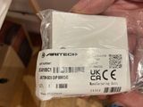 a person holding a white box with a barcode on it