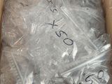 a cardboard box with a lot of plastic items inside of it