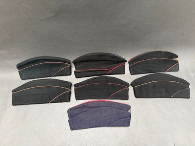 six pairs of hats with red stitching on them on a white background
