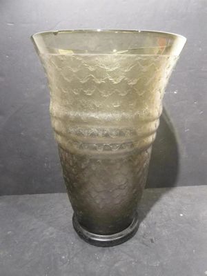 a glass vase that is sitting on a table