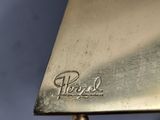 an image of a close up of a metal object on a blue surface