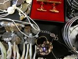 a table with a bunch of jewelry on it