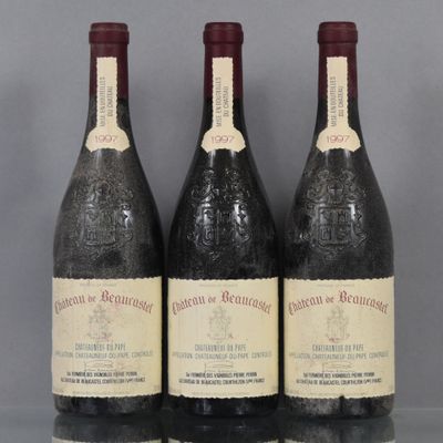 three bottles of wine are lined up on a table