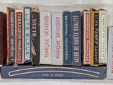 many books in a clear box on a shelf