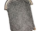 a silver metal purse with a chain around it
