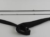 two fishing rods and a fishing rod on a table