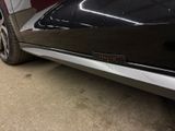 a close up of a black car with chrome trims