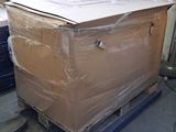 a large box sitting on top of a pallet in a warehouse