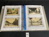 an open book with pictures of a street and buildings on it