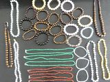 a tray with beads and scissors on it on a table