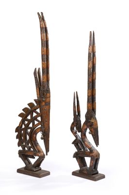 paire de sculptures africaines en bois représentant un oiseau et un poisson