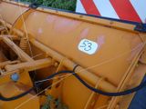 a close up of a large yellow machine with a number 53 on it