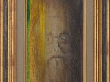 un tableau représentant un homme barbu et portant des lunettes, dans un cadre doré