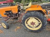 a tractor that is sitting in the dirt