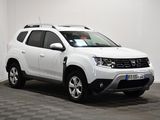 the white dacia is parked in a room with a checkered floor
