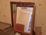 a mirror that is sitting on top of a tree stump