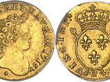 a gold coin with a crown on the front and a crown on the back