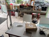 a desk with a lamp on it and a box on the table