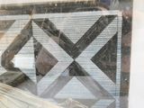 a reflection of a man in the window of a store