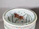 a bowl with a horse on it sitting on a table