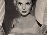 an old black and white photo of a woman in a bikini top