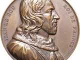 une image montrant un gros plan d'une médaille sur fond blanc