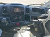 a picture of a dashboard of a truck with a clock