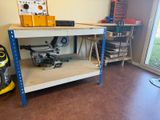 a picture of a workbench in a garage with tools on it