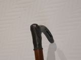 a close up of a walking stick with a handle