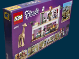 a box of lego friends with a giraffe in it