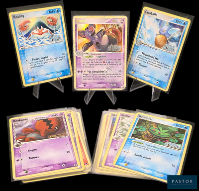 Plusieurs cartes Pokémon sont alignées sur un fond noir.