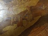 a large vase with a painting on it on a table