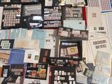a lot of stamps and envelopes laid out on a table