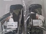 two pairs of gloves that are wrapped in plastic