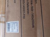 a cardboard box with a label on it and a pair of scissors in it