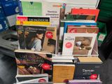 a pile of books on a table in a room