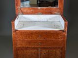 a small wooden cabinet with a mirror on top of it