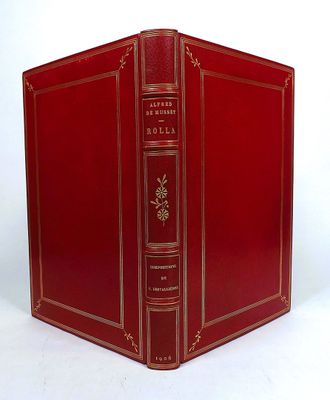 a red book that is open on a white surface