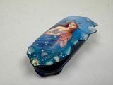 a picture of a bottle with a picture of a mermaid on it