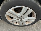 a close up of a tire on a car ' s rim