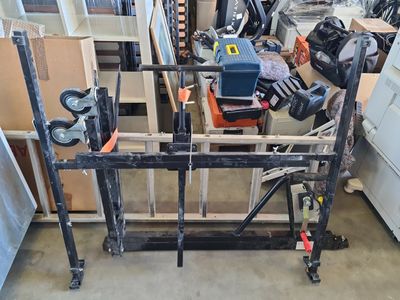 a picture of a garage with a lot of tools on the floor