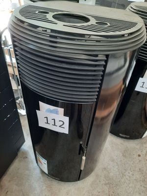 a black and silver air conditioner sitting on the floor