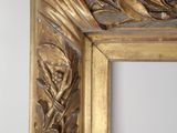 an antique gold frame with a decorative design on the edge