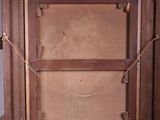 an old photo of a wooden frame with a rope around it